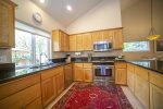 Fully equipped gourmet kitchen with granite slab counter tops